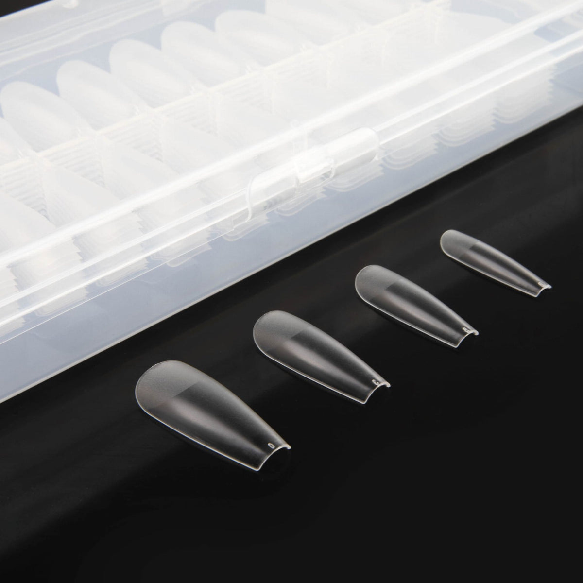 Quelques capsules Flexi Tips Coffin de Nails Company présentées en différentes tailles