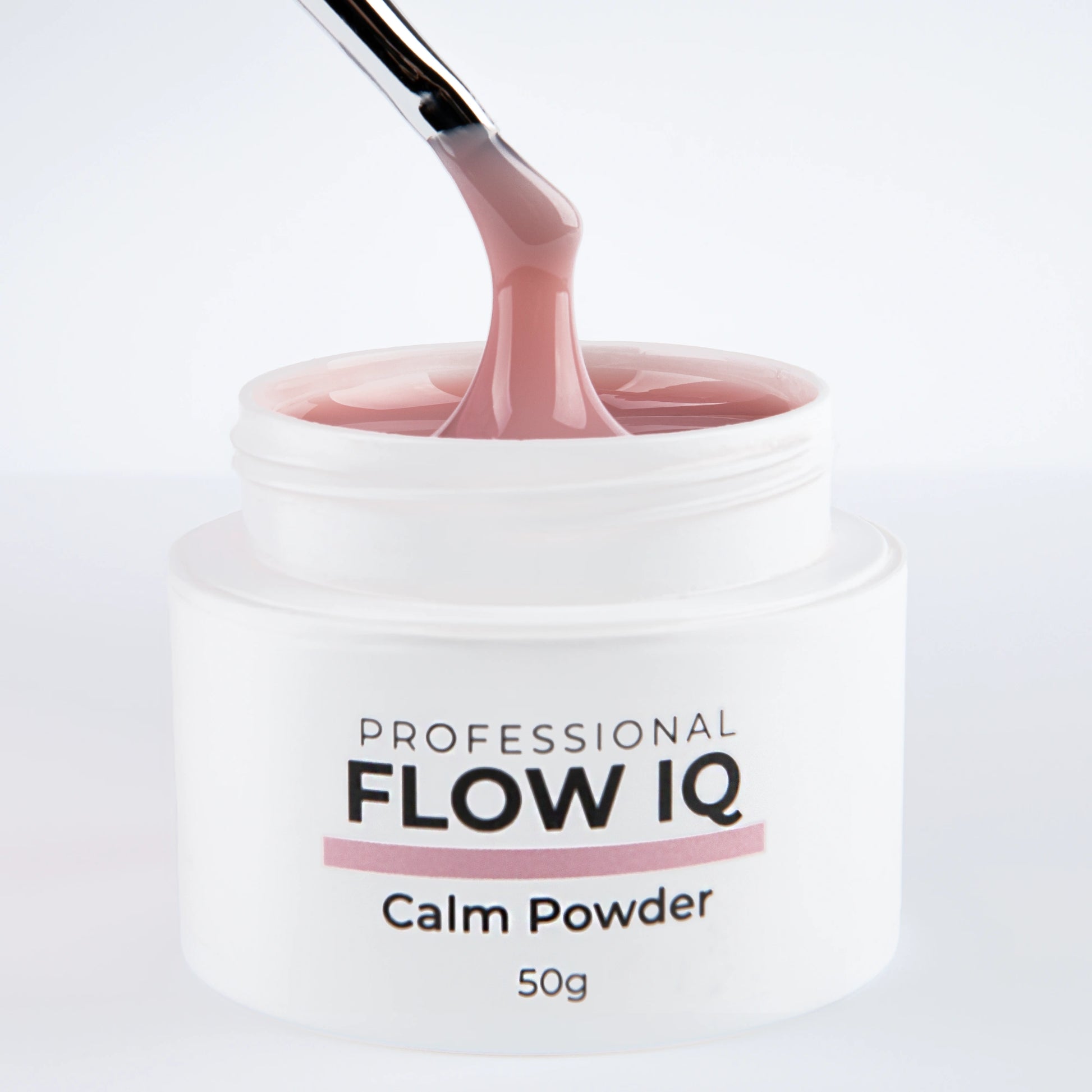 Pinceau tirant la matière du gel Flow IQ Calm Powder Nails Company avec texture auto égalisante visible.