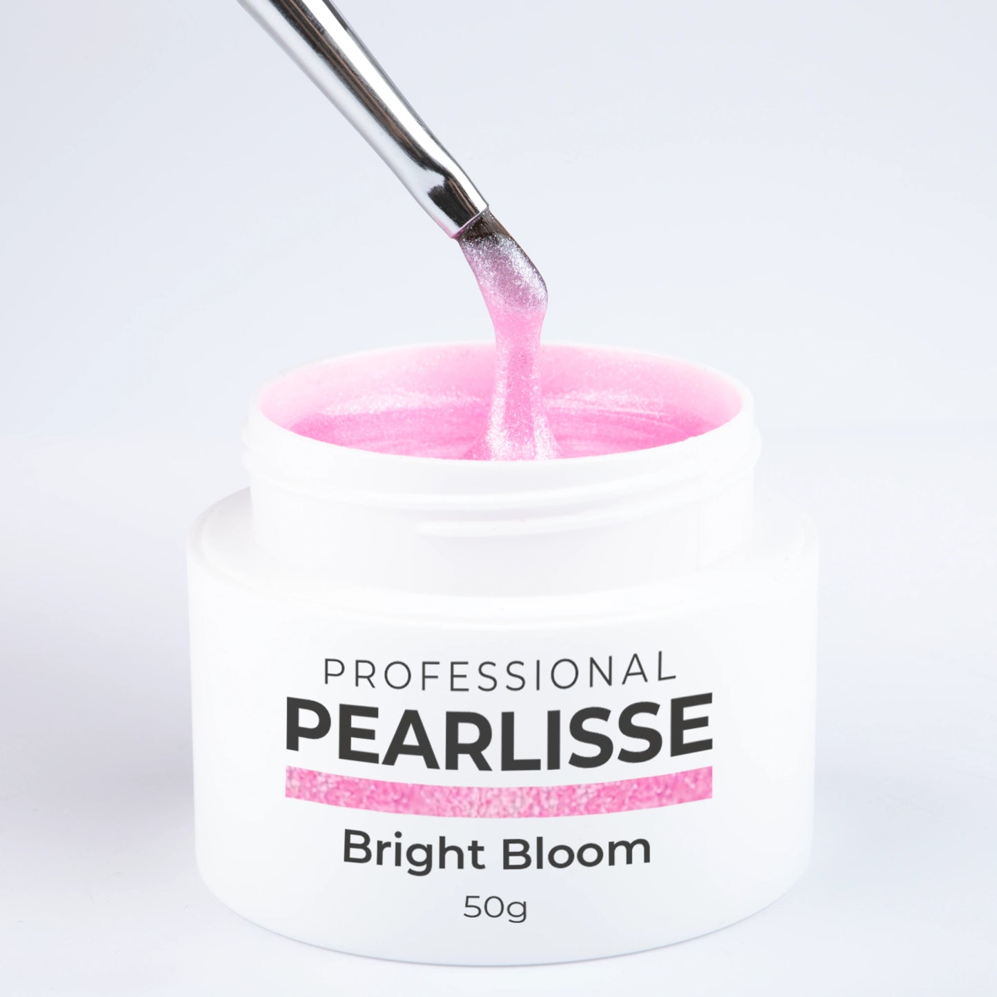 Spatule prélevant le Pearlisse Gel Bright Bloom Nails Company dans le pot ouvert avec texture perlée visible.