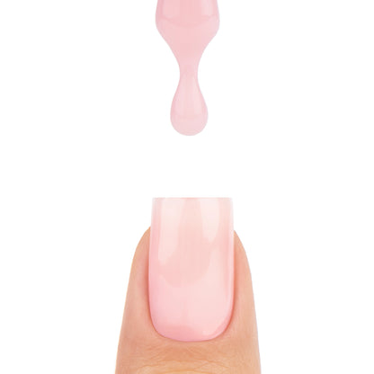 Application de Smart Base Pro Ivory Halo Nails Company avec pinceau et matière crème rosée qui coule.