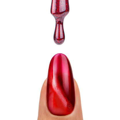 Pinceau avec vernis semi-permanent Glow Virus de Nails Company, rouge cat eye montrant l’effet magnétique en relief